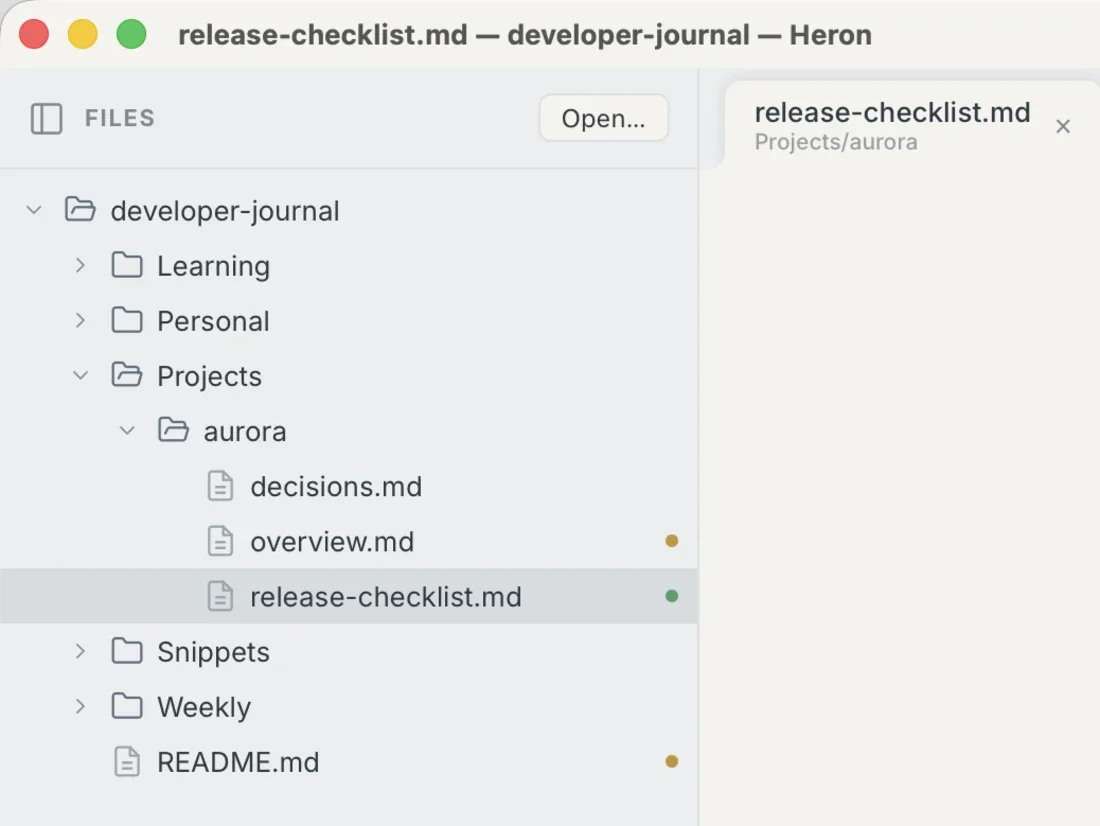 Heron's file sidebar showing an ochre dot beside two modified files and a green dot beside an untracked one